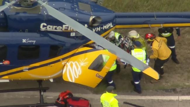 A patient is loaded onto a rescue helicopter for fast transportation to hospital. Picture: Seven News