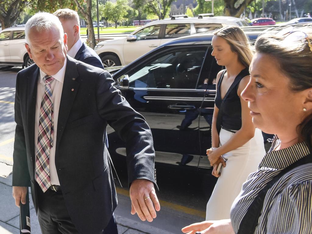 Police Commissioner Grant Stevens and his family arrive at court on Thursday ahead of giving their victim impact statements. Picture: Roy VanDerVegt