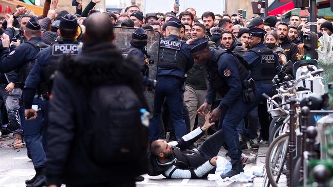 Protesters clashed with police after three people were killed and three injured in a shooting in central Paris on December 23, 2022, police and prosecutors said. Picture: Thomas Samson / AFP.