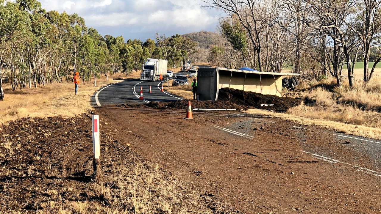 The New England Highway is blocked with manure after a truck's trailer rolled over this afternoon at Ballandean. Picture: Liana Walker