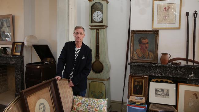 Bryan Fitzgerald, surrounded by collectibles inside the terrace at 723 Bourke St, Surry Hills. Picture: Daniel Aarons