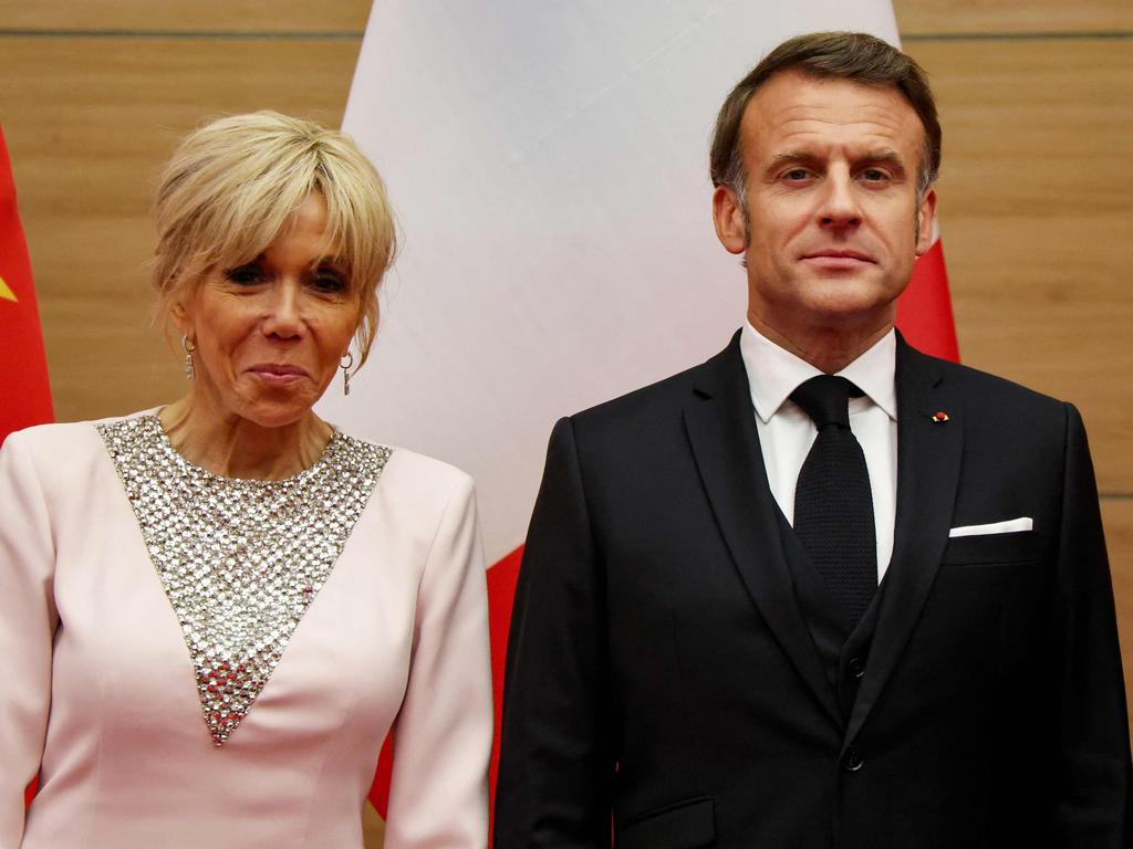 The Macrons were ‘horsing around, having a joke’, the President later said of the footage. Picture: Ludovic Marin/AFP
