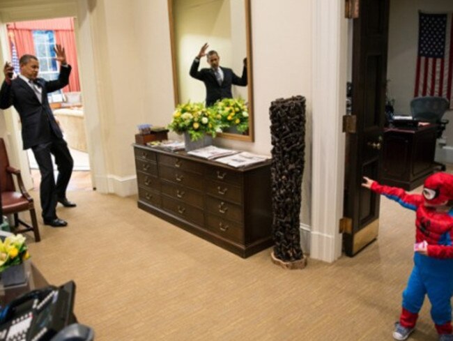 October 2012: President Obama pretends to be defeated by a boy dressed as Spiderman at the White House. Picture: Pete Souza/White House