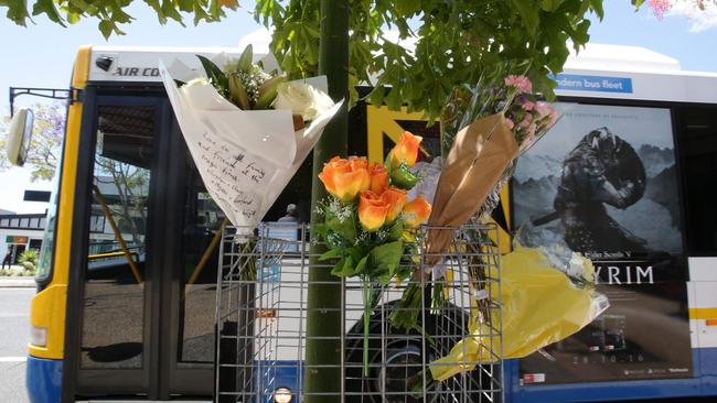 Flowers left at the Moorooka bus stop where driver Manmeet Sharma died. Pic: Steve Pohlner