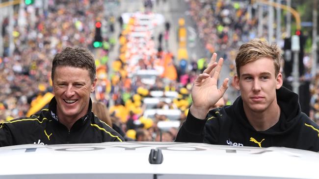 Tom Lynch rides in the Grand Final parade with Damien Hardwick. Picture: AAP