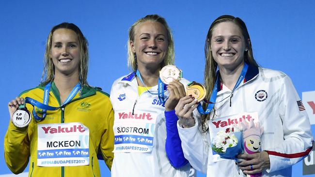 From left: Silver medal winner Emma McKeon of Australia, gold medal winner Sarah Sjostrom of Sweden and bronze medal winner Kelsi Worrell of the United States pose with their medals during the awarding ceremony of the women's 100-meter butterfly final.