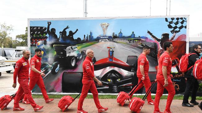 Members of the Ferrari team arrive to pack up their equipment after the Formula One Australian Grand Prix was cancelled in Melbourne in 2020. Picture: AFP