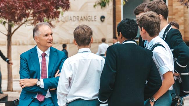 Parents and former students of Newington College are challenging the school’s decision to enrol girls. Pictured: headmaster Michael Parker with students. Picture: newington.nsw.edu.au