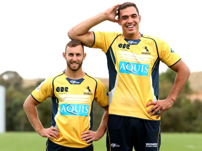 Brumbies halfback Nic White is dwarfed by lock Rory Arnold.