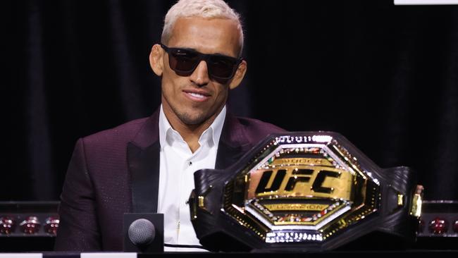 Charles Oliveira with the belt in December. Carmen Mandato/Getty Images/AFP.