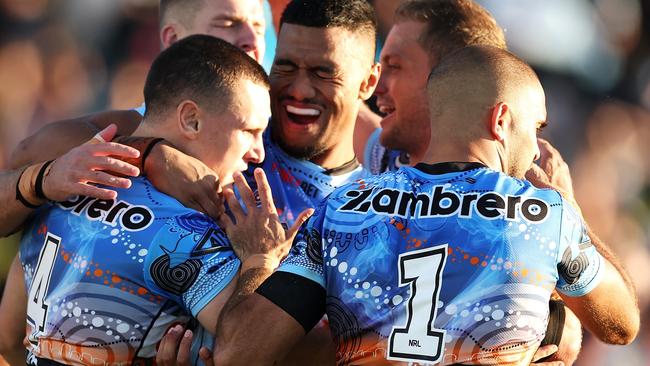 COFFS HARBOUR, AUSTRALIA - MAY 20: Connor Tracey of the Sharks celebrates with his team mates after scoring a try during the round 12 NRL match between Cronulla Sharks and Newcastle Knights at Coffs Harbour International Stadium on May 20, 2023 in Coffs Harbour, Australia. (Photo by Mark Kolbe/Getty Images)