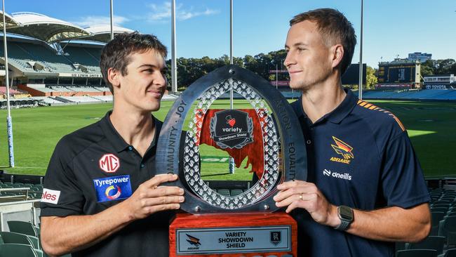 ADELAIDE, AUSTRALIA - MAY 05: Captains Connor Rozee of the Power and Jordan Dawson of the Crows hold the Variety Shield during the AFL Showdown media opportunity at Adelaide Oval on May 05, 2025 in Adelaide, Australia. (Photo by Mark Brake/Getty Images)