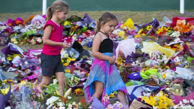 The tragedy at Dreamworld has touched the entire Gold Coast, with people continuing to lay flowers yesterday. Photo by Glenn Hunt/Getty Images)