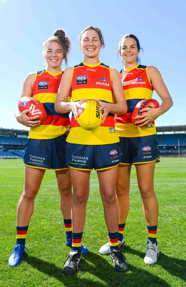 Crows Women AFL players Jenna McCormick, Rheanne Lugg and Sally Riley. The Adelaide AFLW team has inspired many. AAP Image/ Brenton Edwards