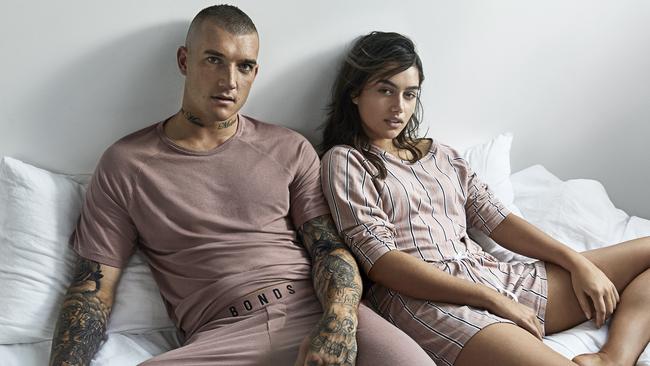 Dustin Martin poses alongside model Maia Cotton for Bonds’ Livin' campaign.