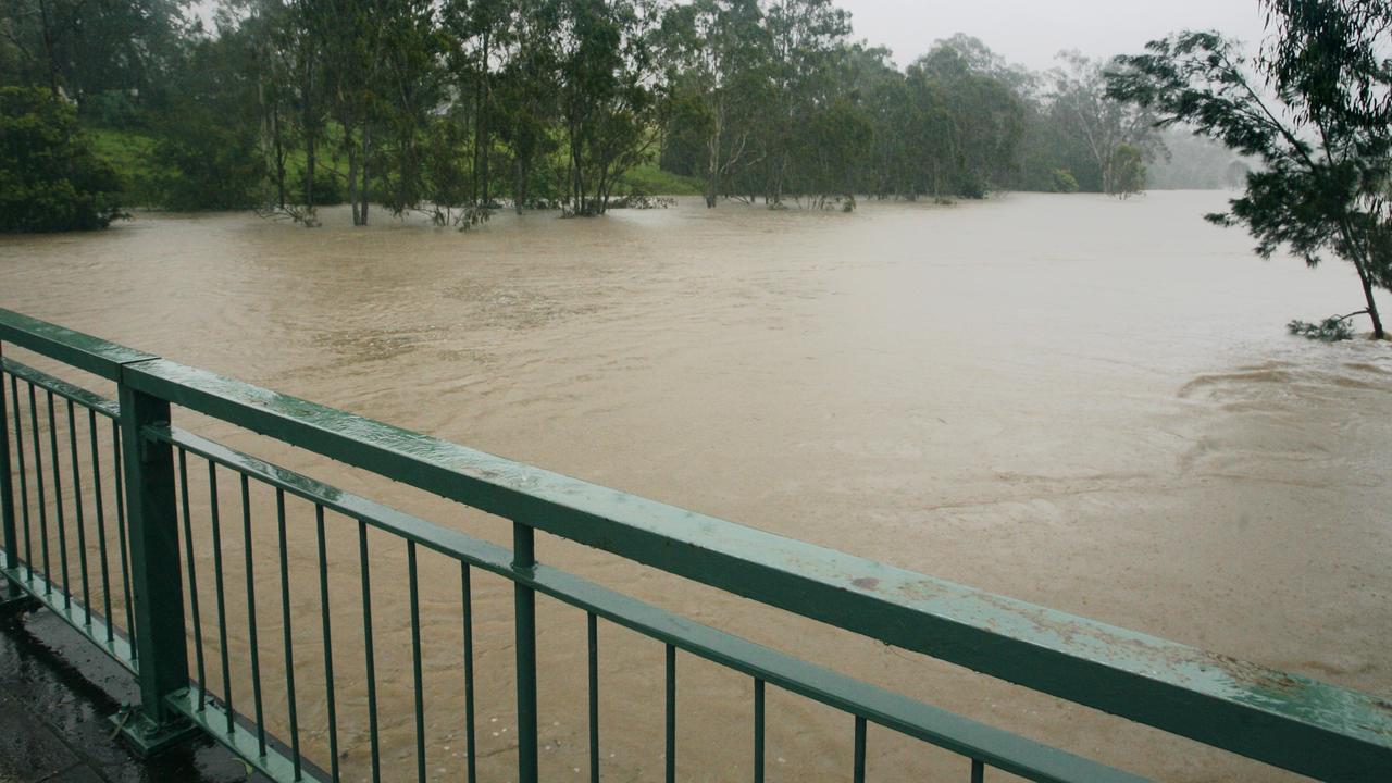 Water flowing under the Hancock Bridge at Brassall as flood waters are due to reach record highs. Photo: Claudia Baxter / The Queensland Times