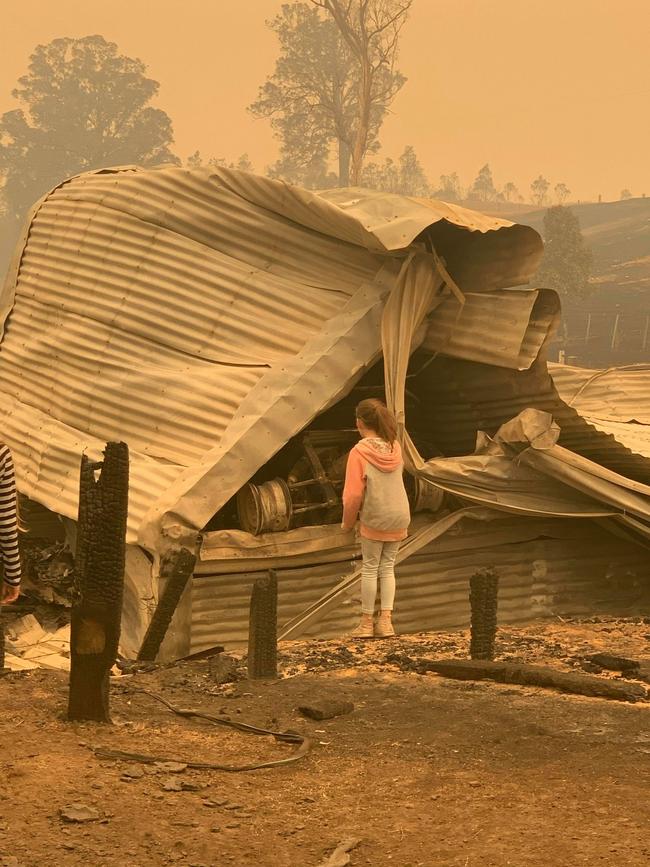 Aaron and Donna McCole see the destruction caused by the fire that ripped through their hometown. Picture: Donna McCole