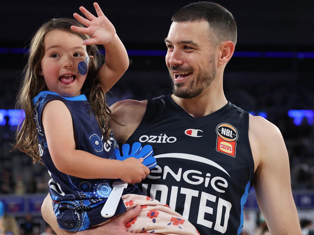 Chris Goulding with daughter Genevieve after his 450th game. Picture: Getty Images