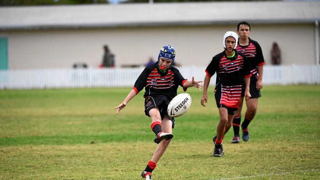 Bundaberg's Dawson Hess kicks the ball away while playing for the Wide Bay Bulls in under-13 at the 47th Battalion. Picture: Brian Cassidy