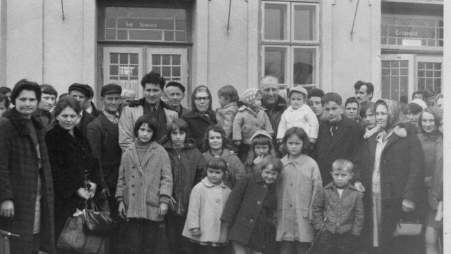 Ivan Maric’s mother's family arrives in Melbourne - his grandmother is on the right of the photo with hand bag in the left hand. His grandfather is the tall man with the white jacket. His mother's nine other brother and sisters are scattered between them. the little girl front and centre, in the white coat, is Ivan Soldo’s mum.