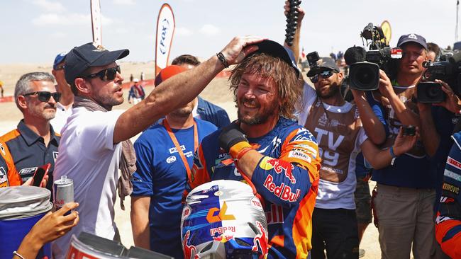 Toby Price is greeted by media in Pisco, Peru, upon winning the Dakar Rally. Picture: Getty Images