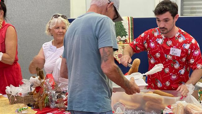 Councillor Ryan Bayldon-Lumsden volunteering at the Labrador Community Centre for the annual Christmas Dinner.