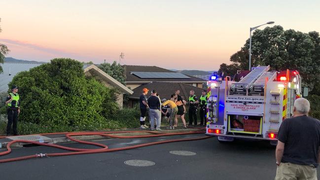 Police and fire personnel at the house fire in Lucinda Parade, Lutana. Picture: RICHARD JUPE