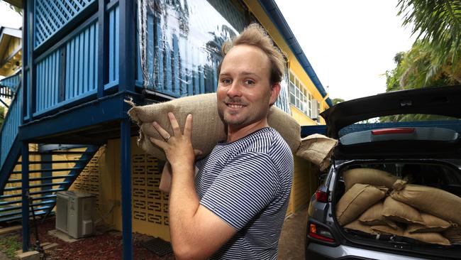 Townsville resident Michael Wood starting to really prepare for Cyclone Kirrily which is due to hit tonight. Picture: Adam Head