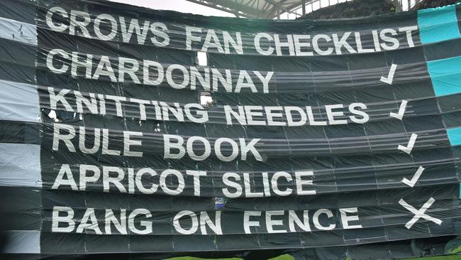 The Power cheer squad’s cheeky banner at Showdown 43. Picture: AAP Image/David Mariuz