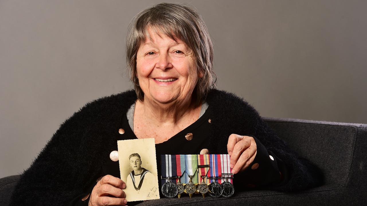 Judith Bronwyn Murphy with her father's World War II medals at the Townsville Bulletin office in 2019. Picture: Shae Beplate/ NewsCorp Australia.