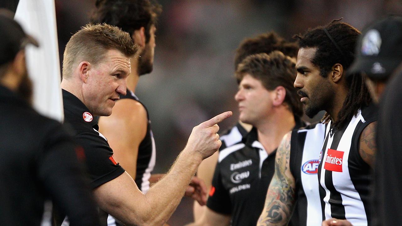 Nathan Buckley speaks with Heritier Lumumba of the Magpies. Photo by Robert Prezioso/Getty Images