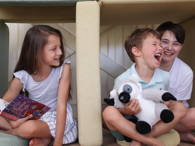 Patrick Rudomino and his wife Olivia pictured with their "lockdown" creation, MY Nook a creative sofa for kids to build, play, and relax in fun spaces. Their kids are Charlie, 14, Carmen, 8, and Hugo 4. Picture: David Swift.