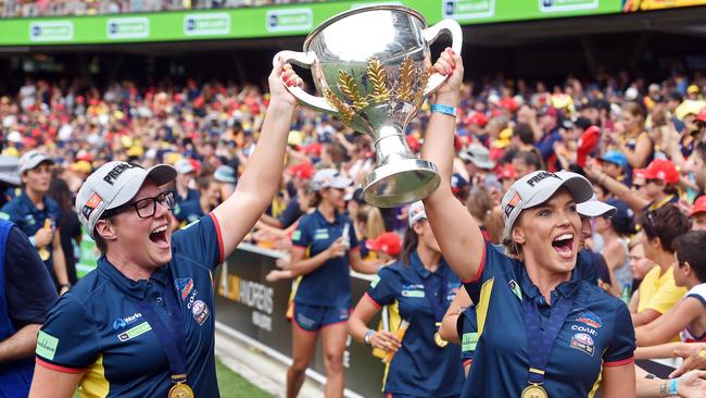 Abbey Holmes and AFLW Adelaide coach Bec Goddard with the premiership cup in 2017. Picture: Tom Huntley