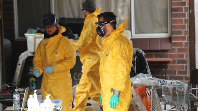 Drug and organised crime task force detectives examine a meth lab found in Morphett Vale in August last year. Picture: Tait Schmaal.