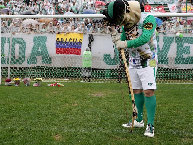 Chapecoense Real’s official mascot pays tribute to the players during a funeral at the team’s home stadium. Picture: Buda Mendes/Getty Images