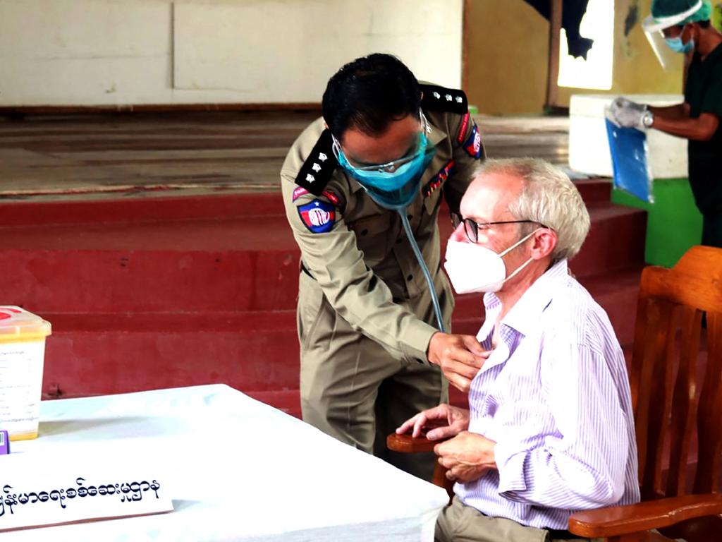 Sean Turnell receives a shot of the Covid vaccine at Insein Prison, according to a military-run newspaper. Picture: Handout / MYANMAR NEWS AGENCY / AFP