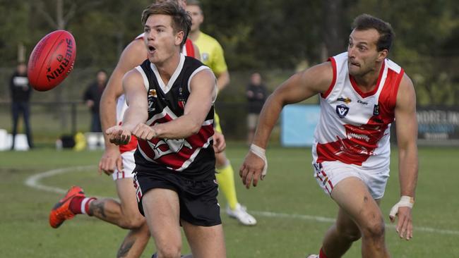 MPNFL: Rhys Hogan of Bonbeach fires off a handball. Picture: Valeriu Campan