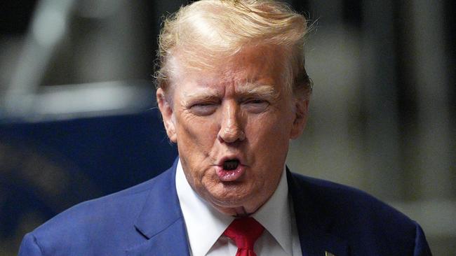 Former US President Donald Trump speaks to the press before leaving for the day at his trial for allegedly covering up hush money payments linked to extramarital affairs, at Manhattan Criminal Court in New York City, on May 10, 2024. (Photo by Curtis Means / POOL / AFP)