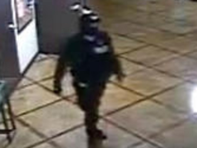 The “cop” as seen on CCTV footage.