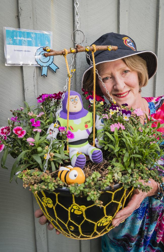 Jo McPherson with the general category winner of Cobb and Co Hanging Basket Display of Toowoomba's Carnival of Flowers. Picture: Kevin Farmer