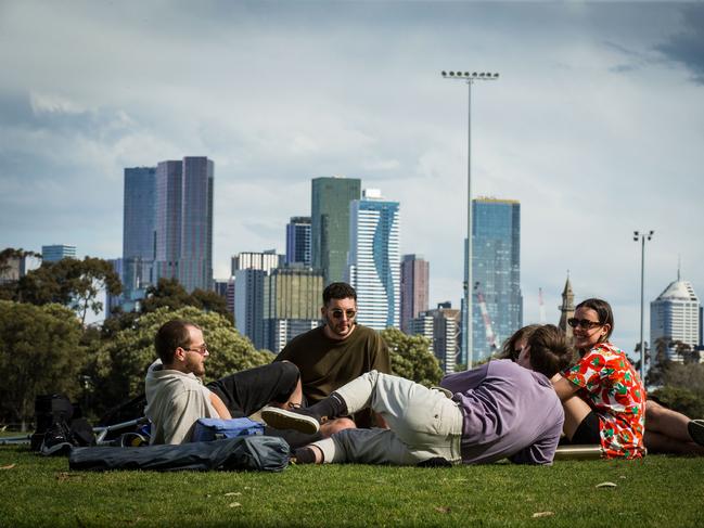 People enjoy a picnic at Princes Park in Carlton on Saturday. Picture: Darrian Traynor