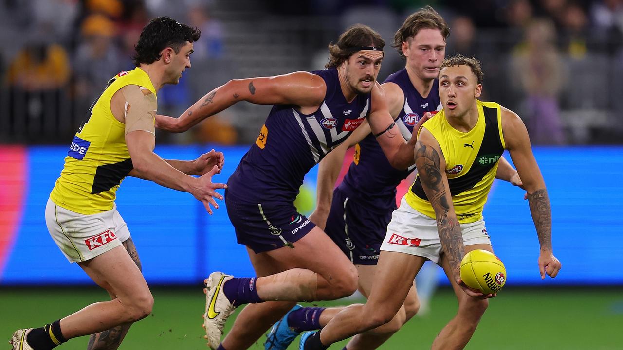 PERTH, AUSTRALIA - JUNE 10: Shai Bolton of the Tigers looks to handball during the round 13 AFL match between Fremantle Dockers and Richmond Tigers at Optus Stadium, on June 10, 2023, in Perth, Australia. (Photo by Paul Kane/Getty Images)