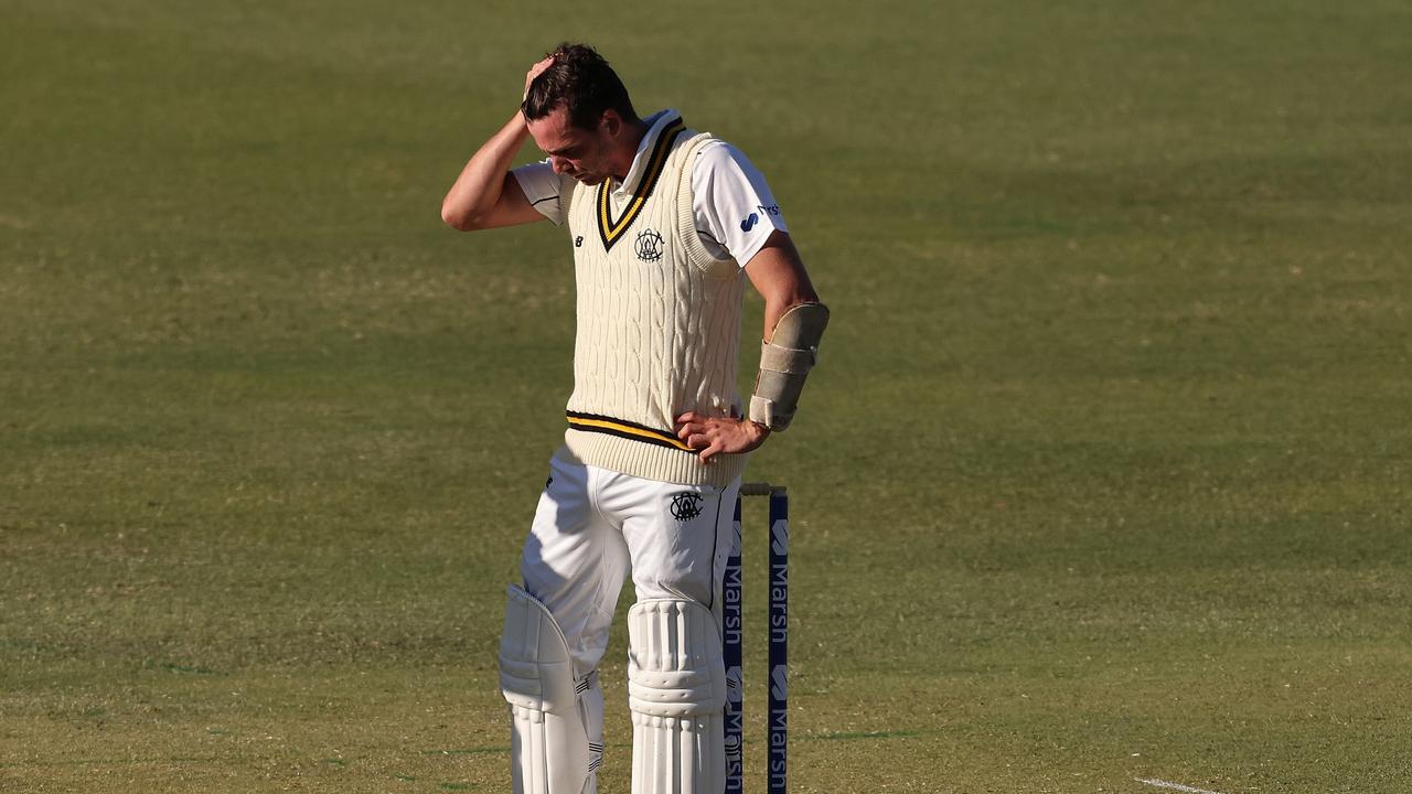 PERTH, AUSTRALIA – OCTOBER 17: Jhye Richardson of Western Australia takes a moment after being hit by a delivery from Peter Siddle of Tasmania during day one of the Sheffield Shield match between Western Australia and Tasmania at the WACA, on October 17, 2021, in Perth, Australia. (Photo by Paul Kane/Getty Images)