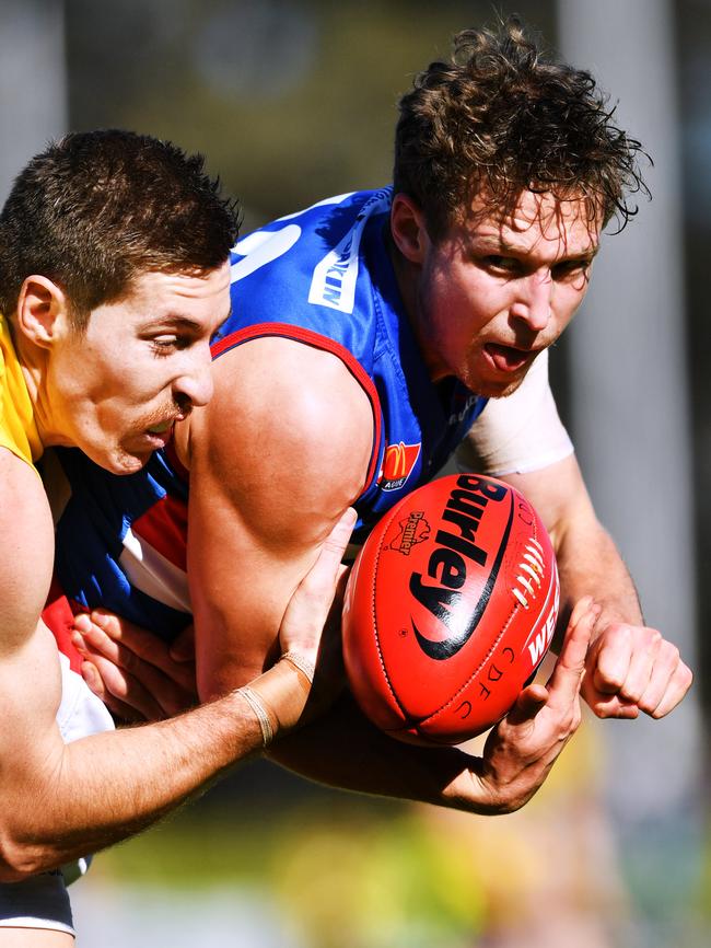 Louis Sharrad tackles Bulldog Bendan Dew. Picture: Mark Brake/AAP