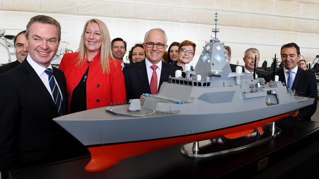 Then prime minister Malcolm Turnbull, centre, former defence industry minister Christopher Pyne, left, and BAE head Gabby Costigan, third left, with a model of the Hunter Class Frigate in Adelaide in June 2018. Picture: AAP