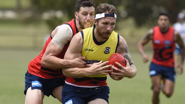 Sam Menegola tackles Zach Tuohy. Picture: Alan Barber