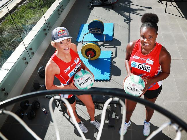 17/4/20: Helen Housby (blonde with cap) and Sam Wallace, two international stars of the NSW Swifts who live together and have set up a makeshift gym on their balcony to train in isolation. Both players are shooters, and they have set up a ring at home to train. John Feder/The Australian.