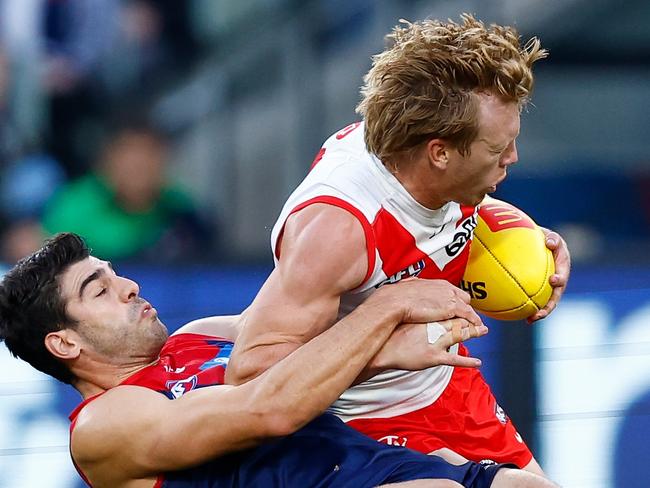 MELBOURNE, AUSTRALIA - APRIL 02: Callum Mills of the Swans is tackled by Christian Petracca of the Demons during the 2023 AFL Round 03 match between the Melbourne Demons and the Sydney Swans at the Melbourne Cricket Ground on April 2, 2023 in Melbourne, Australia. (Photo by Michael Willson/AFL Photos via Getty Images)