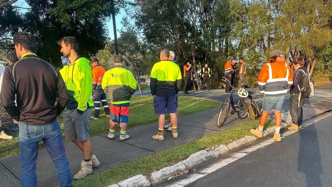 Workers were gathered outside of the Palmer Coolum Resort in Yaroomba on the morning of August 9.