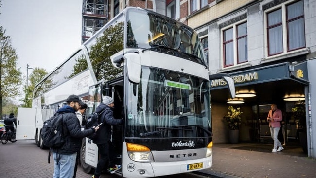 Maccabi Tel Aviv fans leaving a hotel in Amsterdam a day after they were the targets of violent attacks. Picture: Remko de Waal/AFP/Getty Images